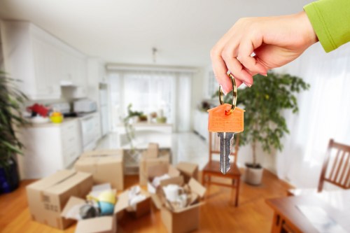 Professional removals team handling furniture carefully