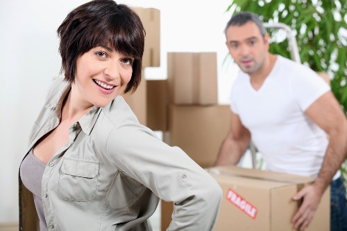 Packed moving boxes and protective wrapping prepared for a Mayfair relocation