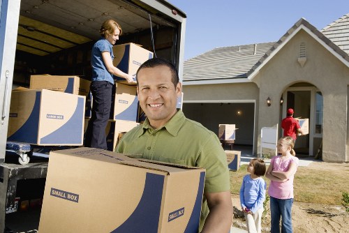 Loading furniture into a removal truck in Mayfair
